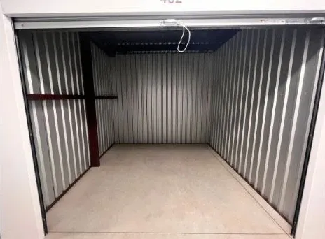 Medium-sized storage unit interior, well-organized.