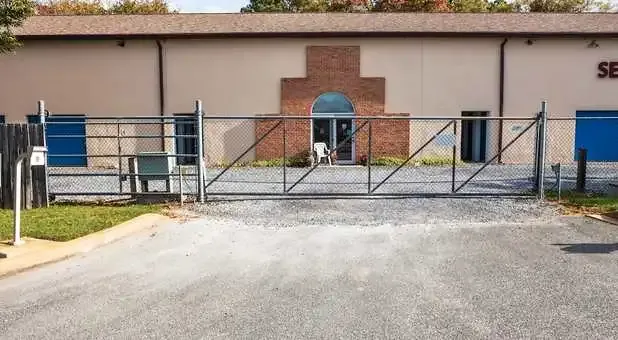 Close-up of a secure keypad gate access at the facility.
