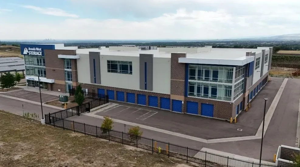 Exterior view of a secure storage facility with gated access