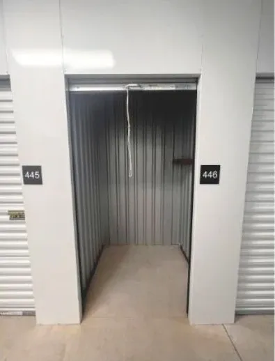 Small storage unit with organized shelves and compartments.