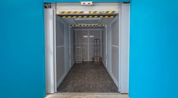Freight elevator inside a storage facility for moving heavy items.